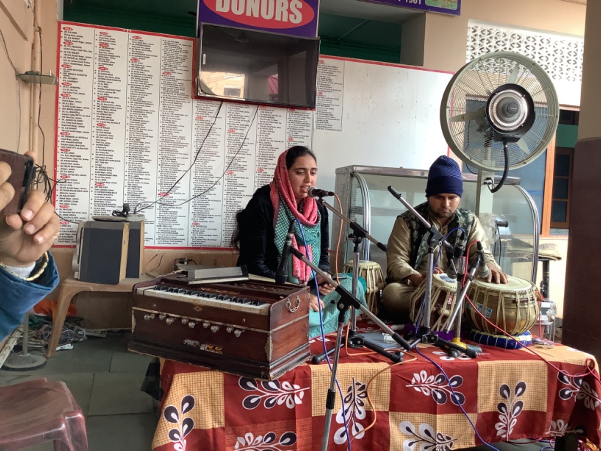 Students of music department presented bhajans  at old age home.